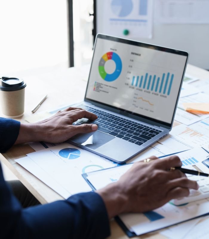 Close up Business man of financial analyze about company's graph profit. finance, strategy, meeting concept.